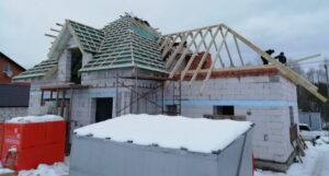 Multi-gable roof framing before replacement