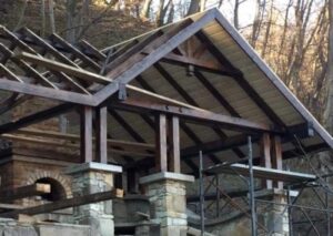 Exposed timber roof frame before completion